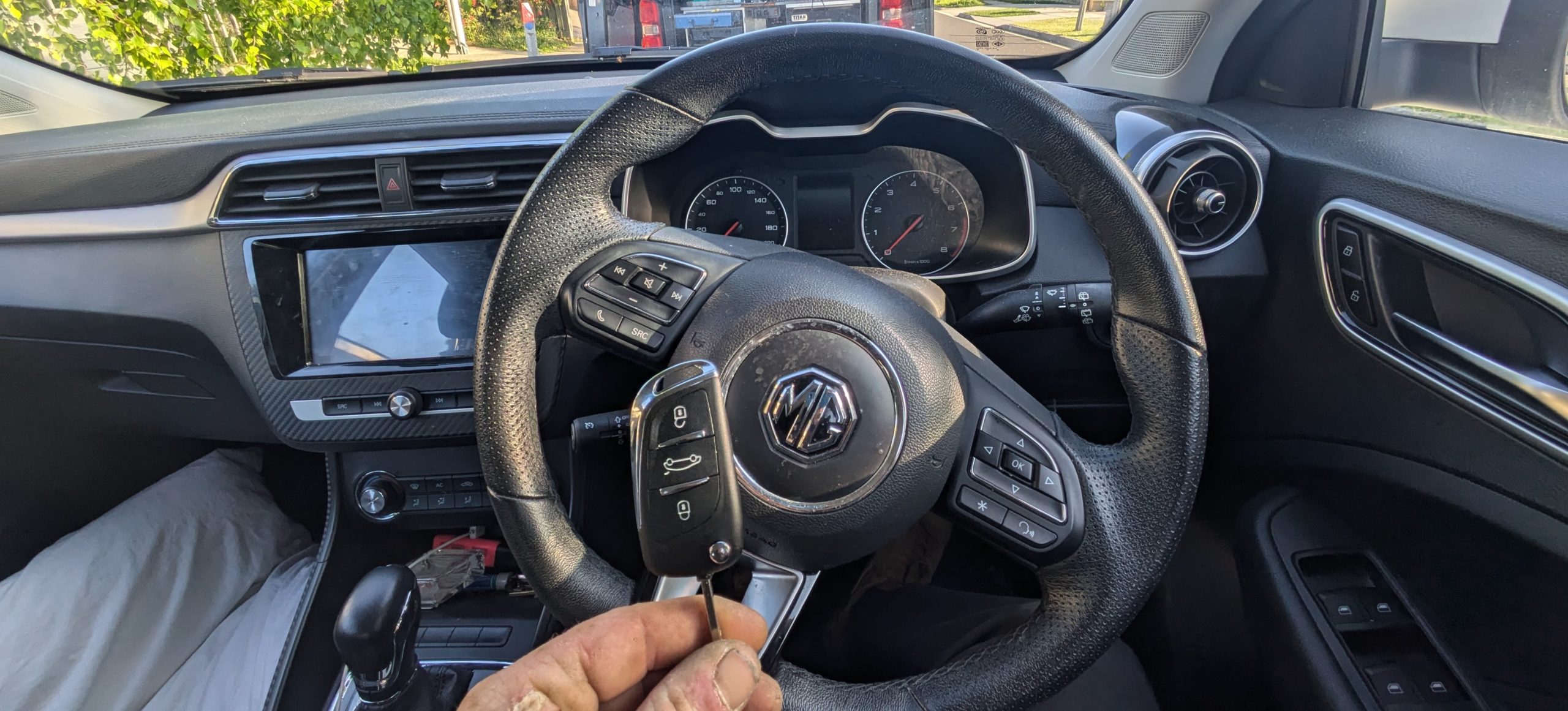 Car key replacement for MG vehicle onsite with new remote flip key supplied, cut and programmed by Narre Warren Locksmiths